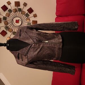 Full lined Jacket with front exposed zipper and exposed accent zipper on cuffs.